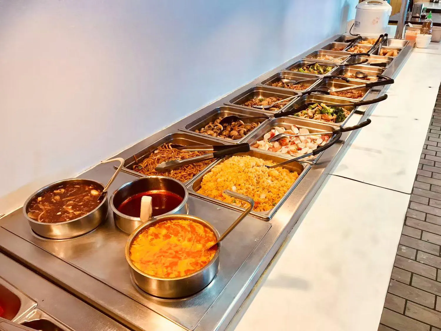 Interior of Buffet restaurant Hong Kong Buffet with Self service dining table for Chinese cuisine Brownfield