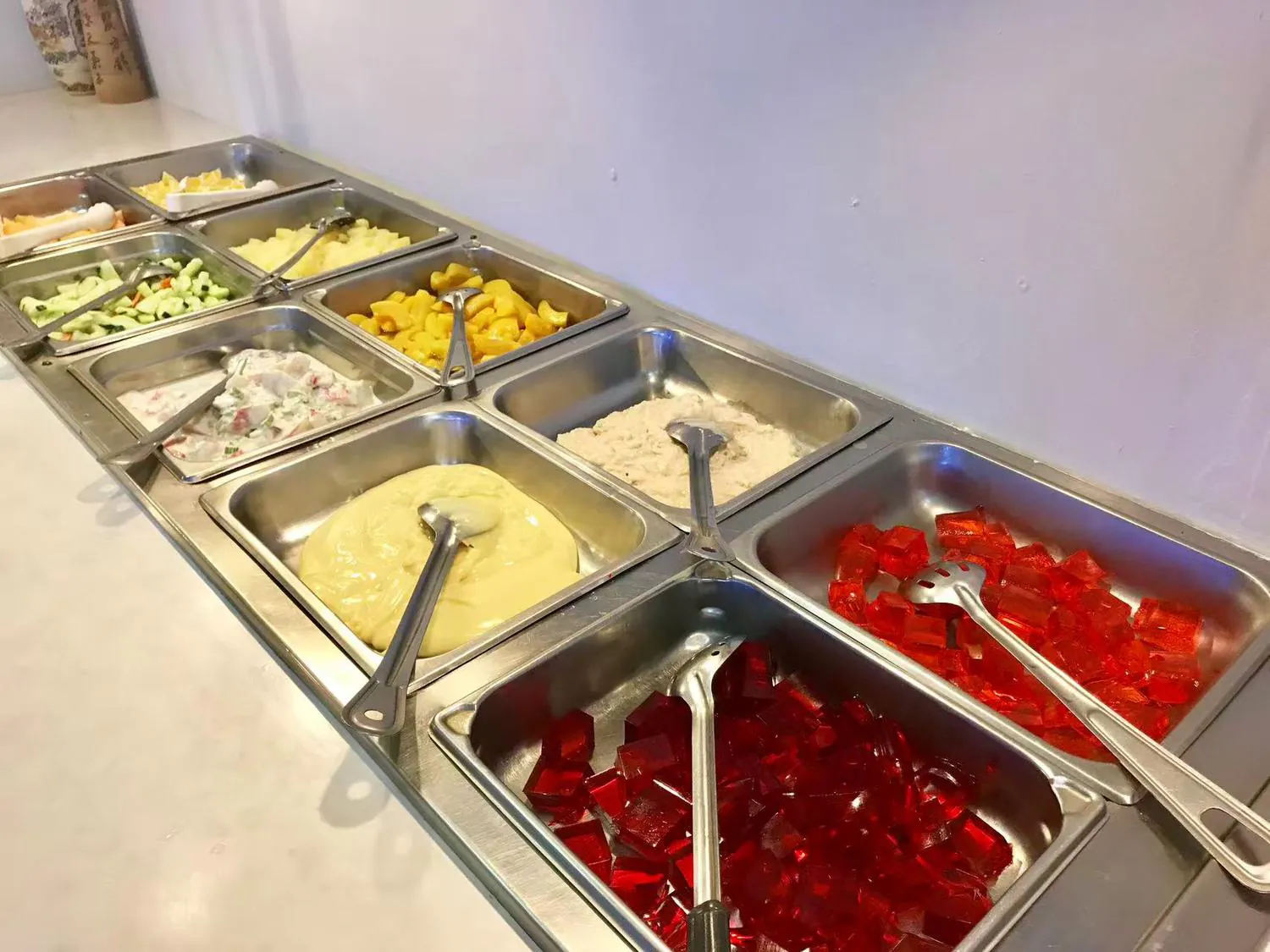Interior of Buffet restaurant Hong Kong Buffet with Self service dining table for Dessert Brownfield